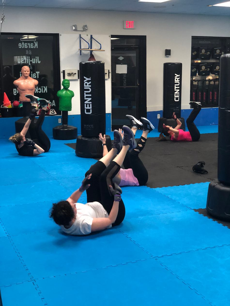 Fitness Kickboxing Women working their abs Fitness Kickboxing Women working their abs
