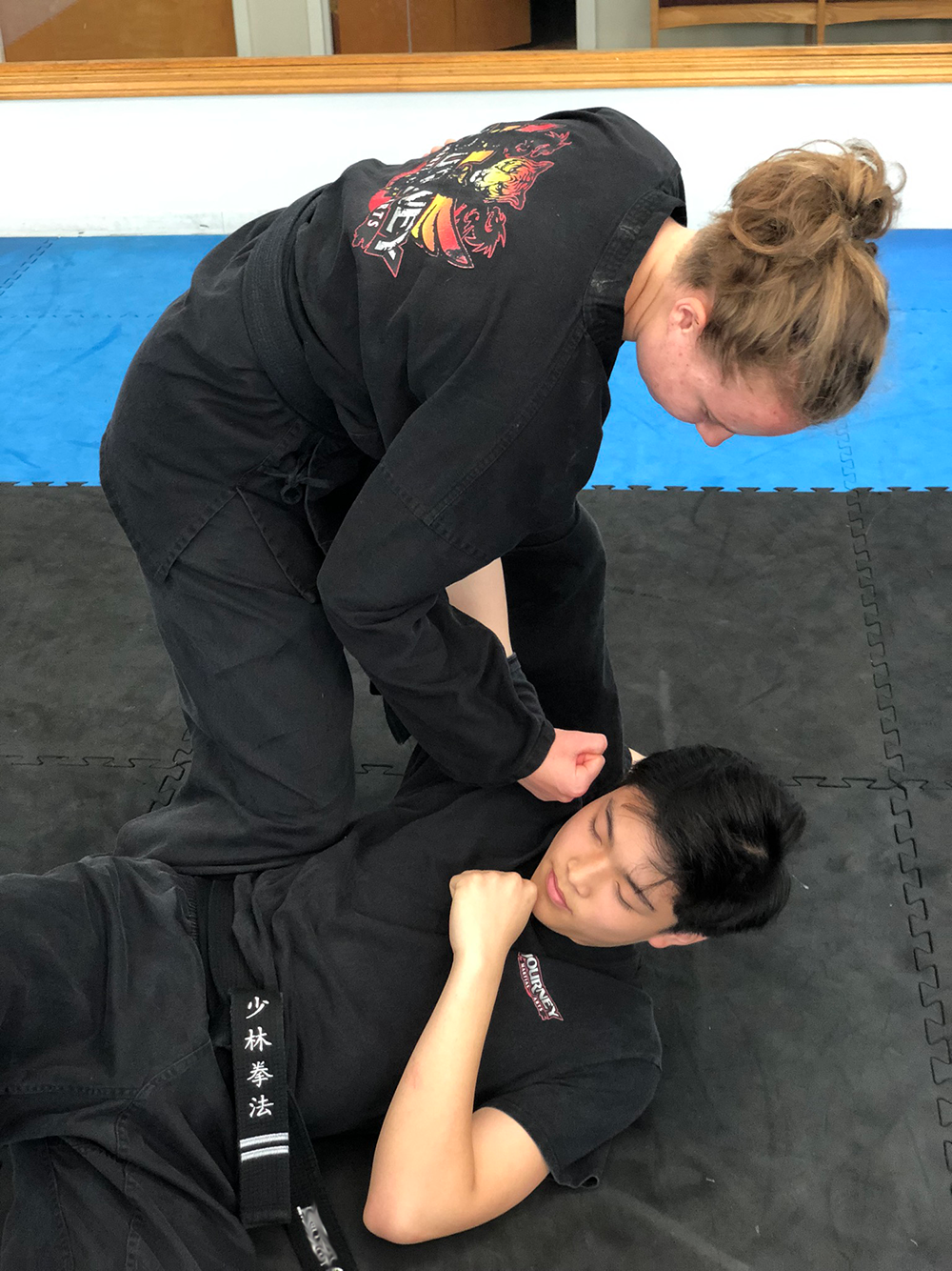 Journey Martial Arts Teen thrust punching a teen opponent